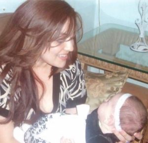 Monique holding Denise as a baby. From the moment she was born she required hypoallergenic formula.