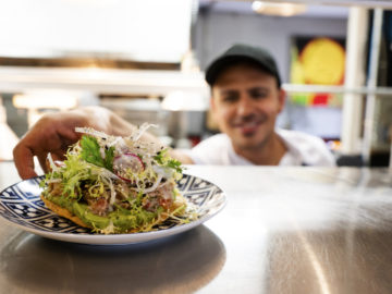 A Mexican chef working in an authentic Mexican restaurant kitchen