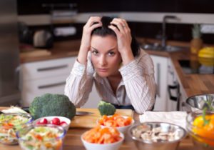 Sad woman in kitchen.
When Allergies Lead to Fear of Food