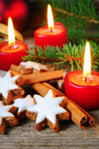 Traditional cinnamon stars biscuits over wooden texture