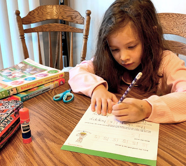Mia Giuliani doing schoolwork at home.