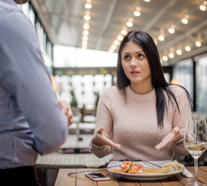 Woman questions restaurant food order