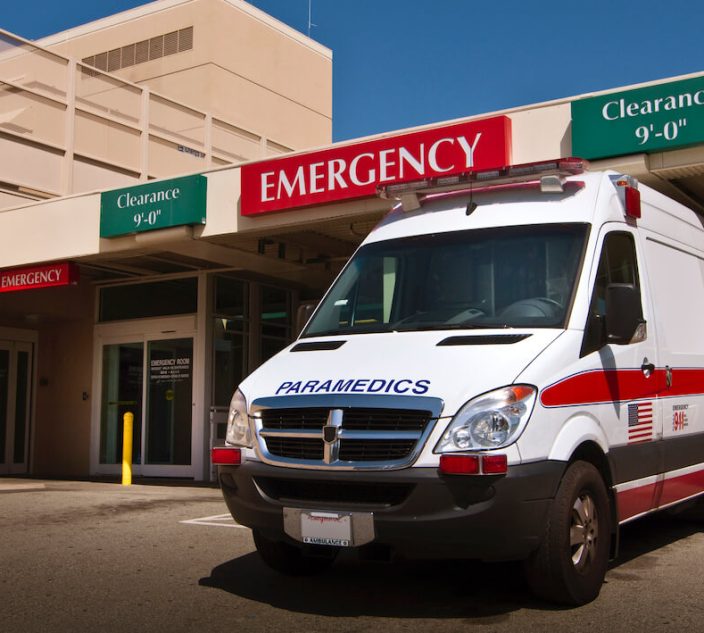 Ambulance in front of emergency entrance to hospital