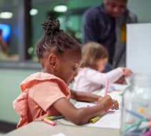 child at daycare coloring.