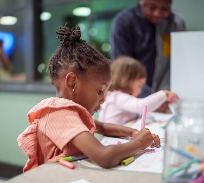 child at daycare coloring.