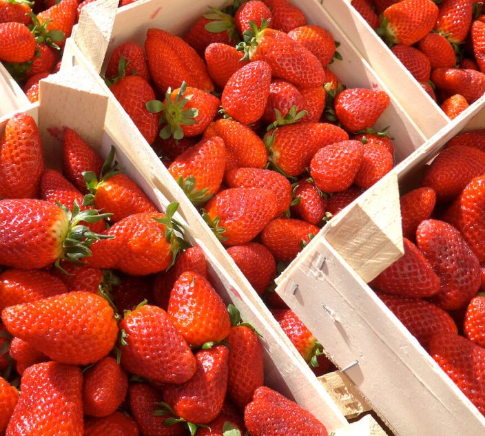 Strawberries in wooden boxes.