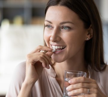 Woman taking pill