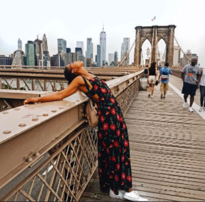 Lindiwe on a bridge in New York City, feeling the relief of not needing to apologize.